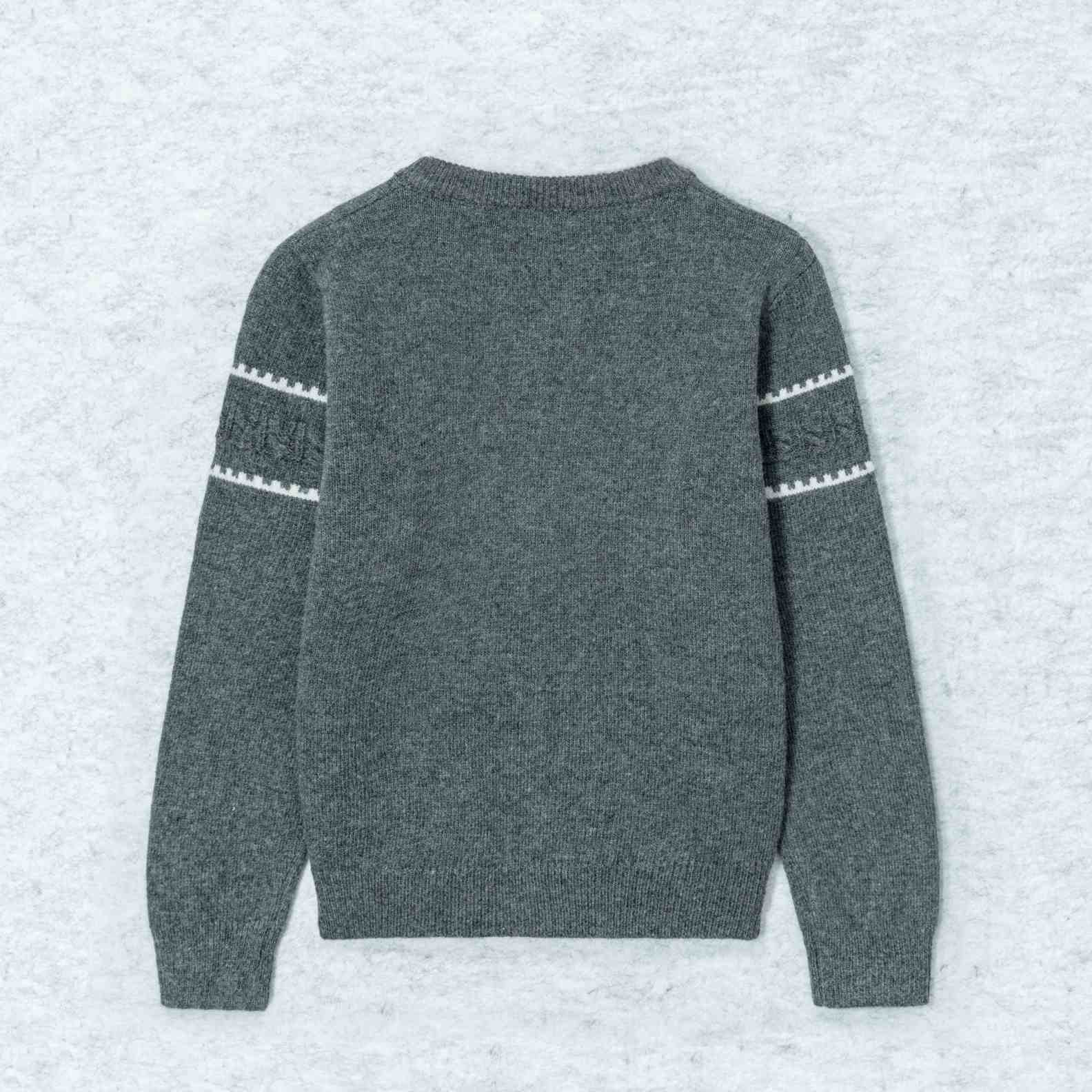 A cozy wool knit cardigan in heather grey. Featuring a classic round neck, a button-front closure, and white geometric intarsia bands across the chest and sleeves. (7)